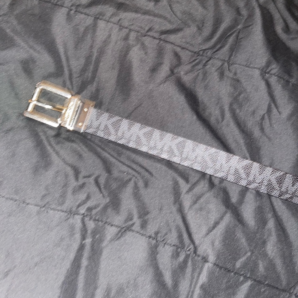only worn a few times. It is reversible dark brown side and black side